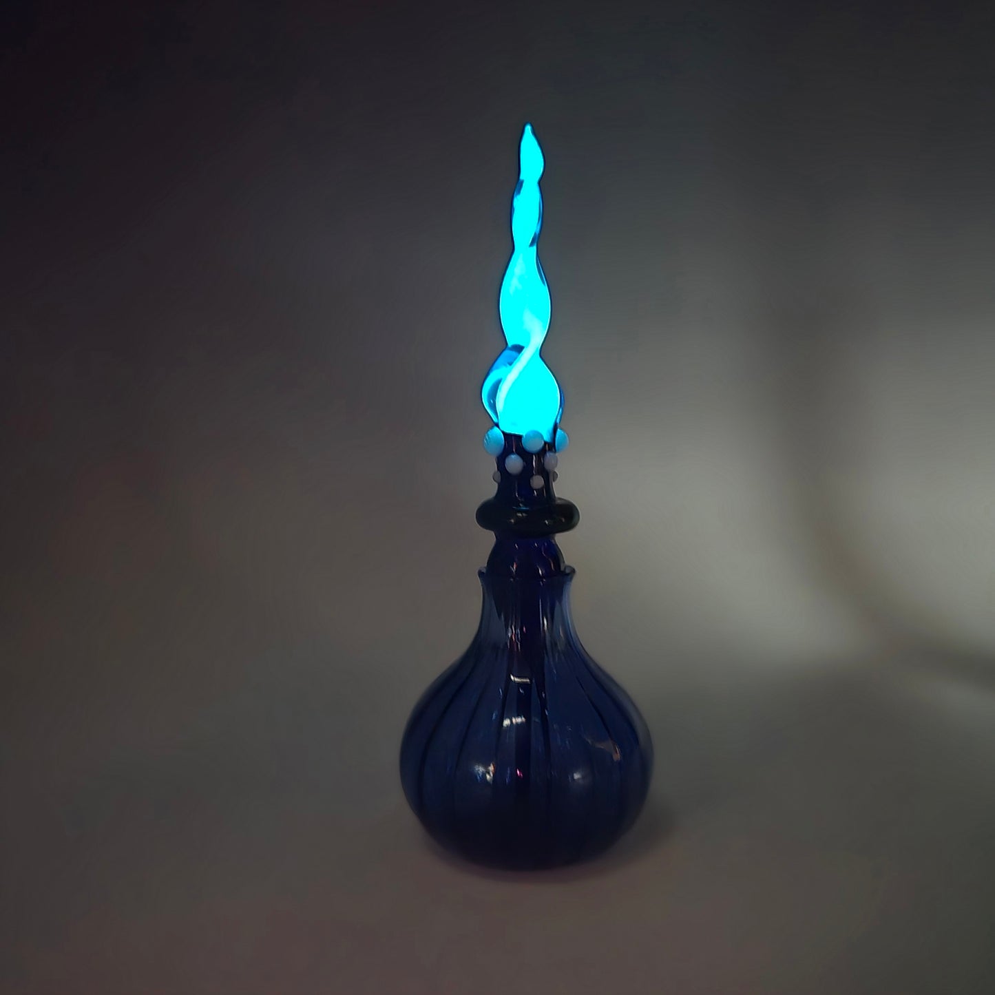 Blue Glowing Perfume Bottle
