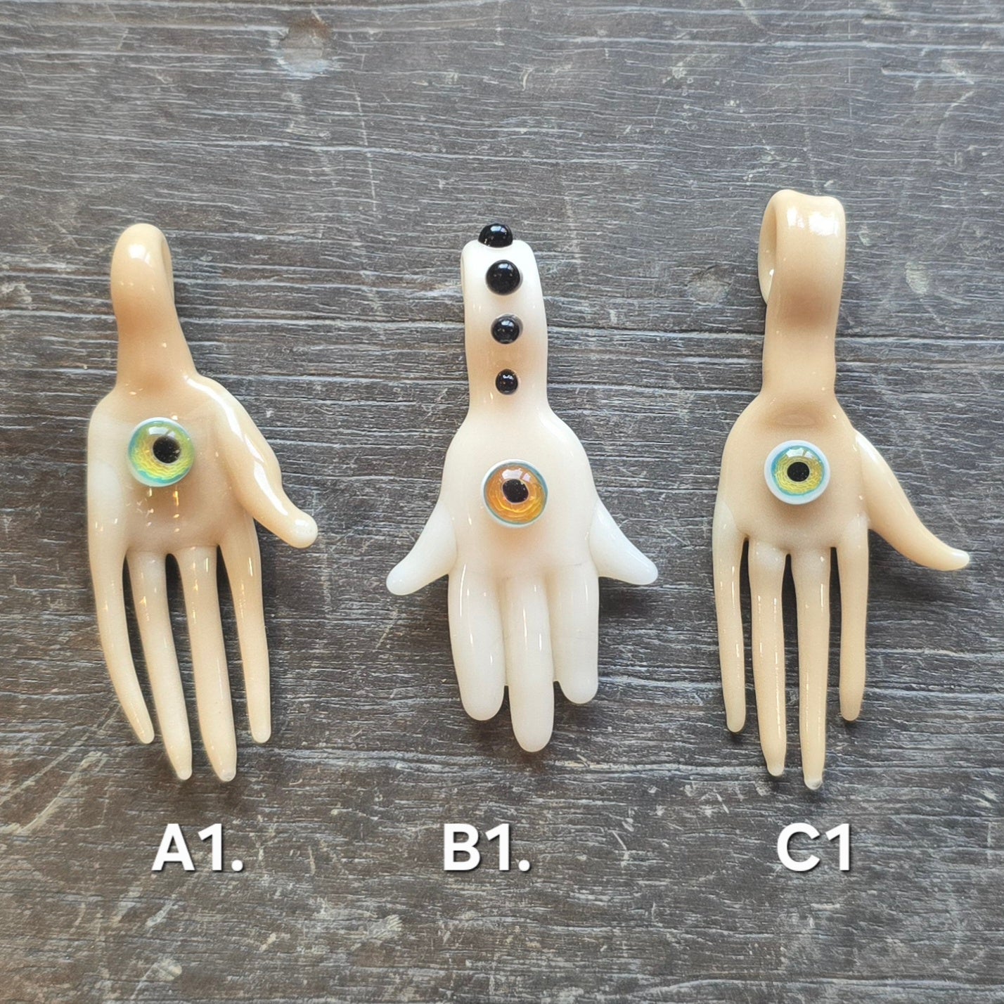 Hand and Eyeball Pendants