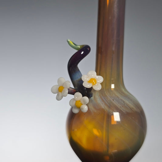 Perfume Bottle with decorative Daisy elements on a gray background